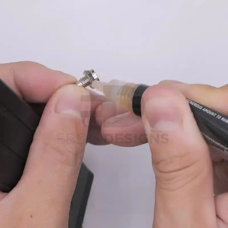 4uantum High Viscosity Airtight Sealant applied to the threads of a metal gas valve screw