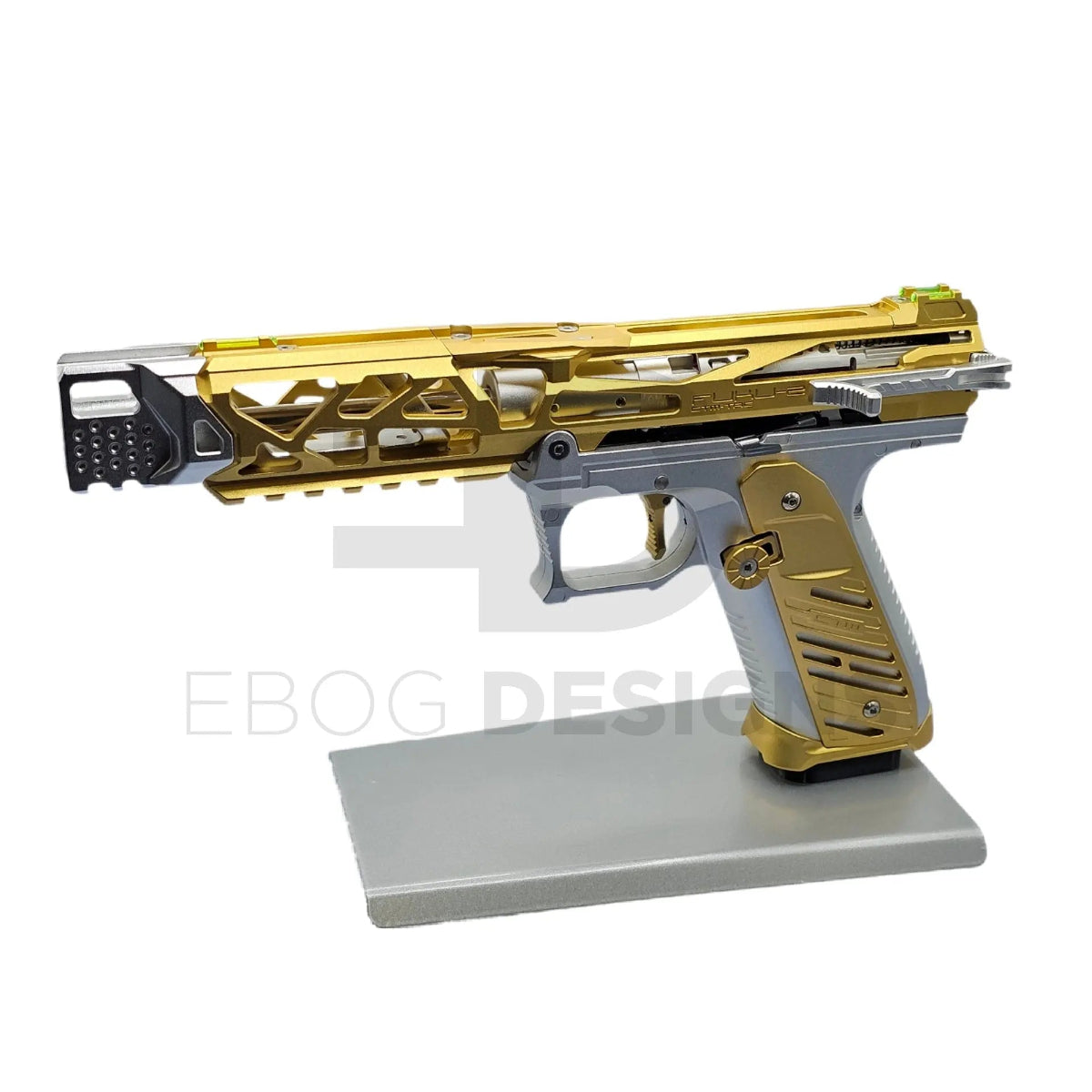 Ebog Designs custom AAP-01 pre-build with a gold skeletonised CNC upper and silver frame, fitted with full CTM parts, shown on a silver display stand