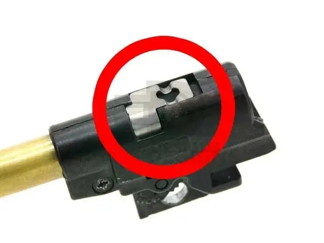 AIP stainless steel hop-up spring shown installed in the hop-up chamber, highlighted with a red circle