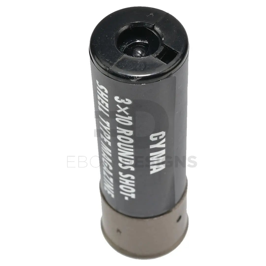 CYMA airsoft shotgun shell, black, stood upright showing the BB loading mouth and tan base