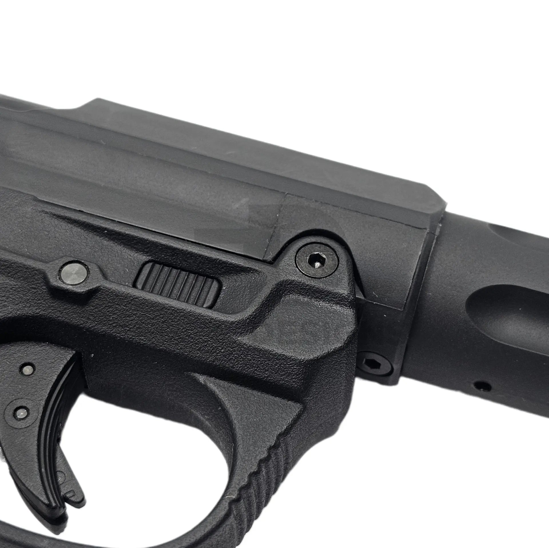 Ebog Designs AAP-01 XL trigger housing side screw fitted to the side of an AAP-01 trigger housing, black