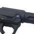 Ebog Designs AAP-01 XL trigger housing side screw fitted to the side of an AAP-01 trigger housing, rainbow