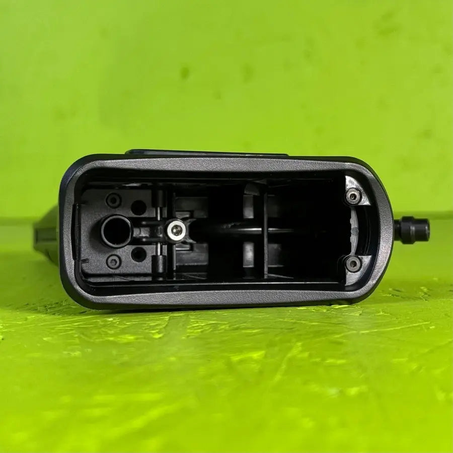 Ebog Designs Hi-Capa to M4 HPA adapter, bottom view into the open M4 well showing the internal gas routing and feed port