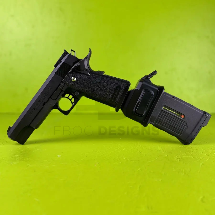 Ebog Designs Hi-Capa to M4 HPA adapter installed in a Hi-Capa pistol, M4-style HPA housing protruding from the magwell