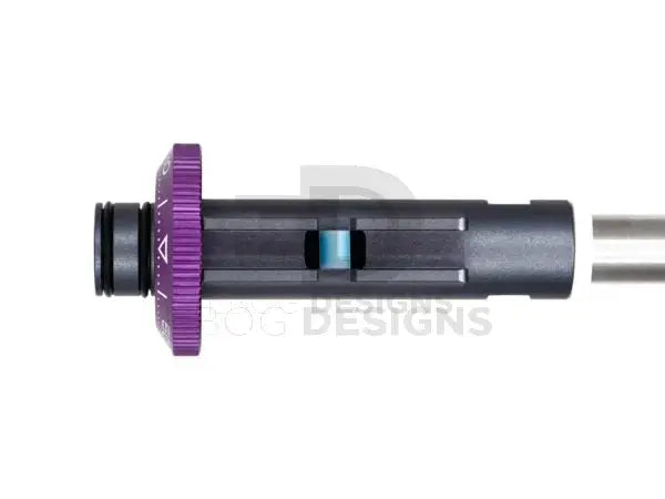 Silent Industries blue extended hop-up nub installed in an Alpha hop chamber with a purple adjustment wheel