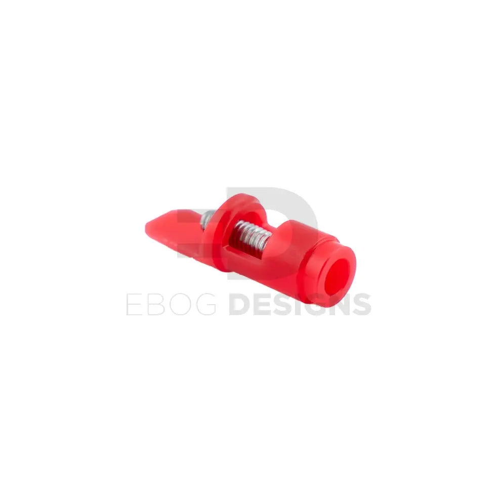 Waldo Dynamics Crimson NPAS nozzle shown horizontally, in red, with the nozzle opening and stainless adjustment screw visible