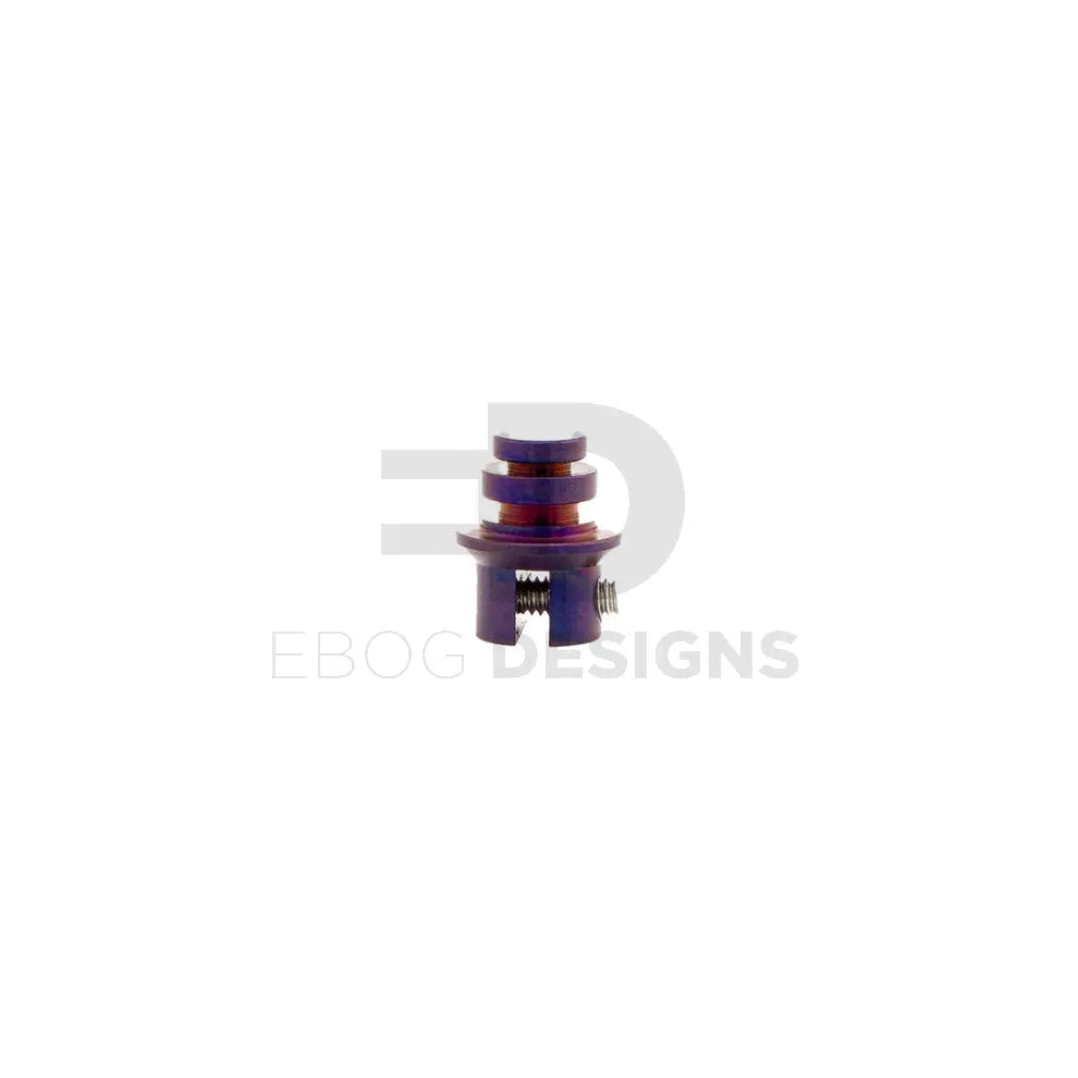 Waldo Dynamics VFC AR quick-change nozzle spring plug stood upright, purple anodised, showing the stepped head and threaded base