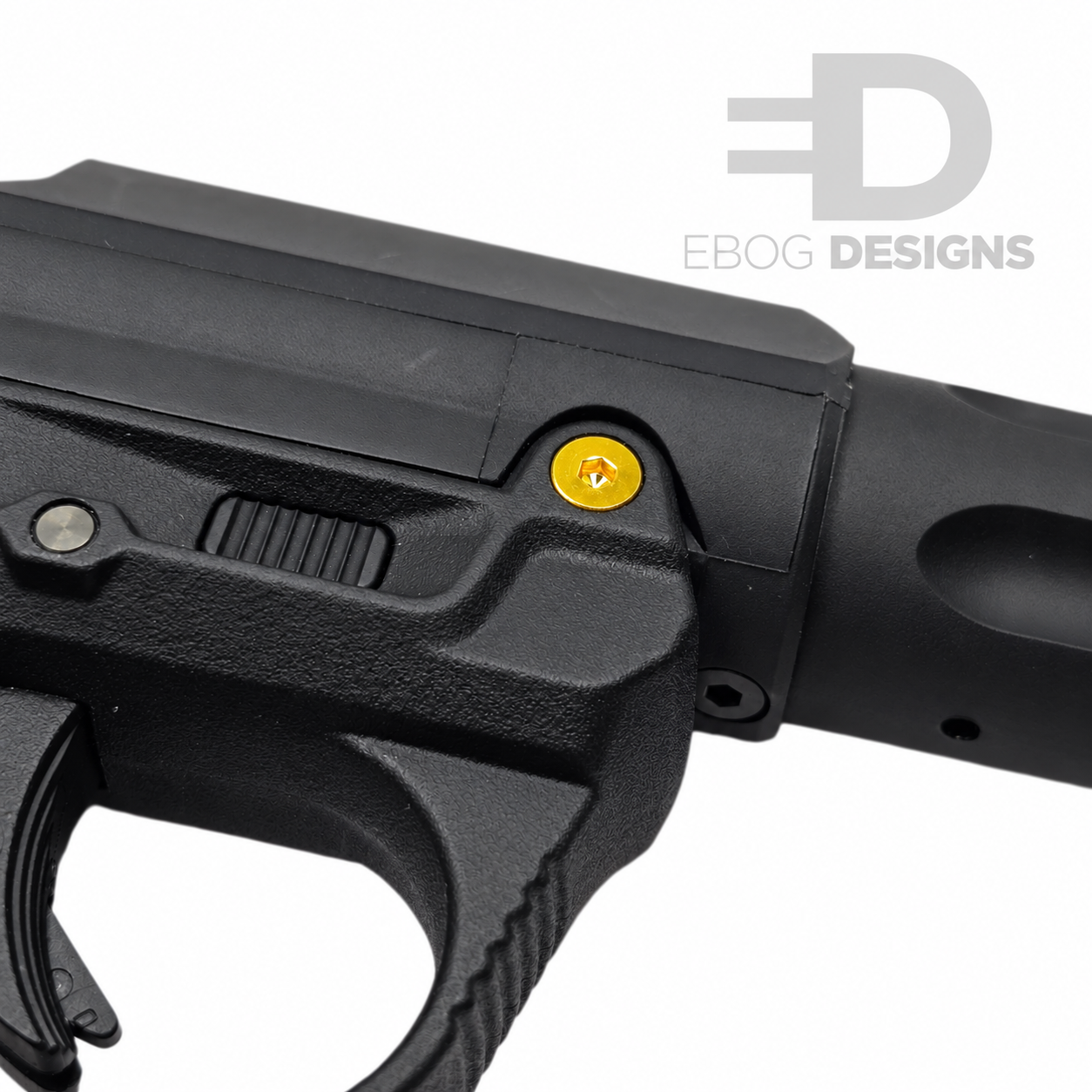 Ebog Designs AAP-01 XL trigger housing side screw fitted to the side of an AAP-01 trigger housing, gold